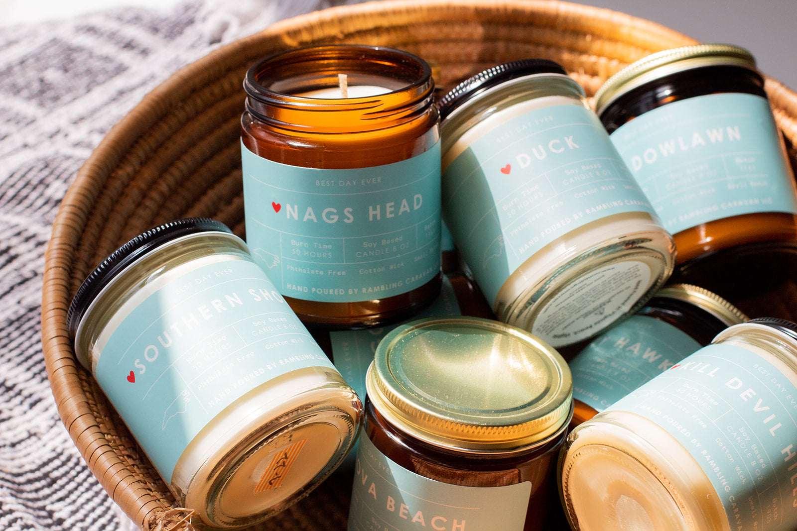 Basket of soy-based candles with labels showing different locations.