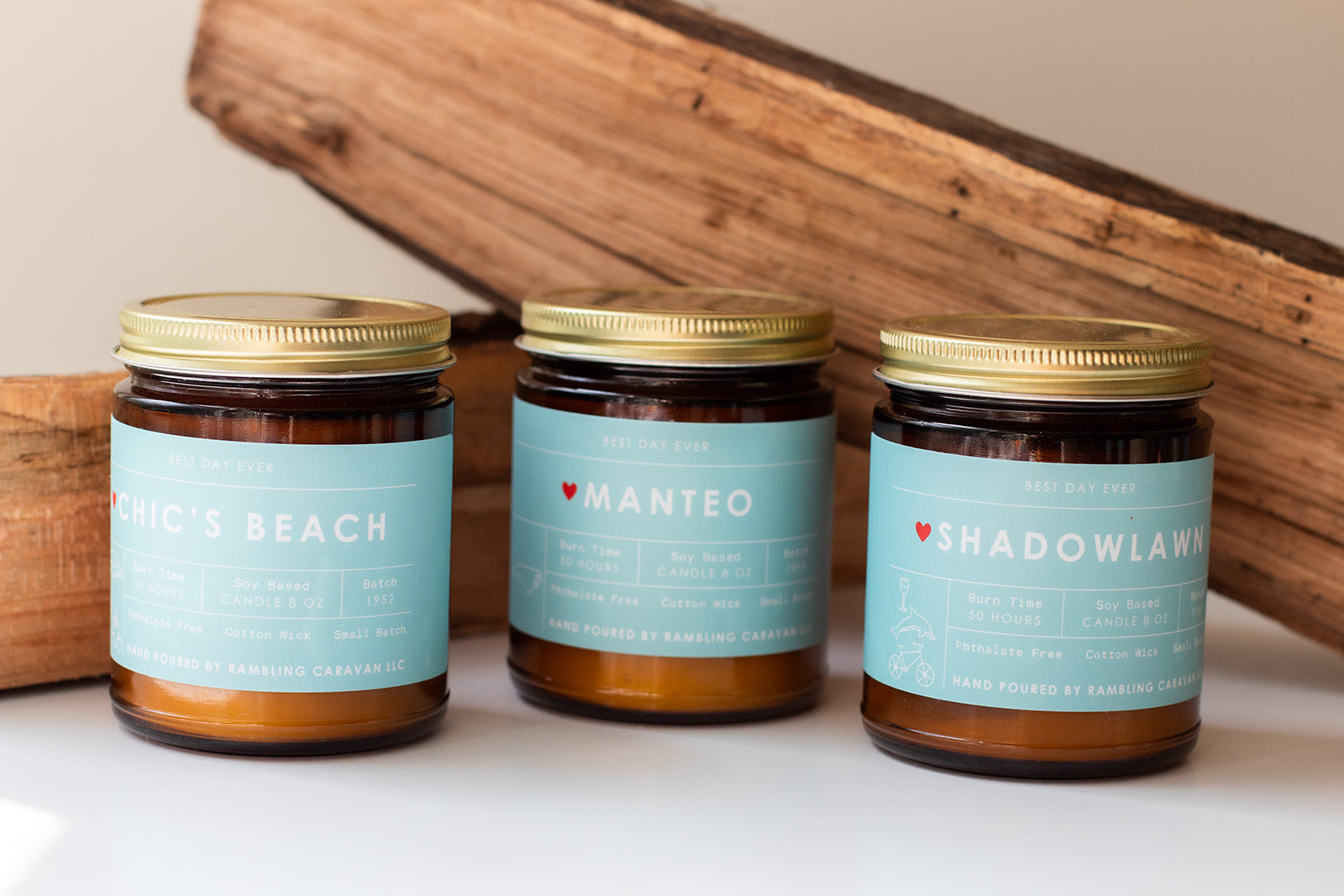 Neighborhood candles with Chic's Beach, Manteo, and Shadowlawn labels.