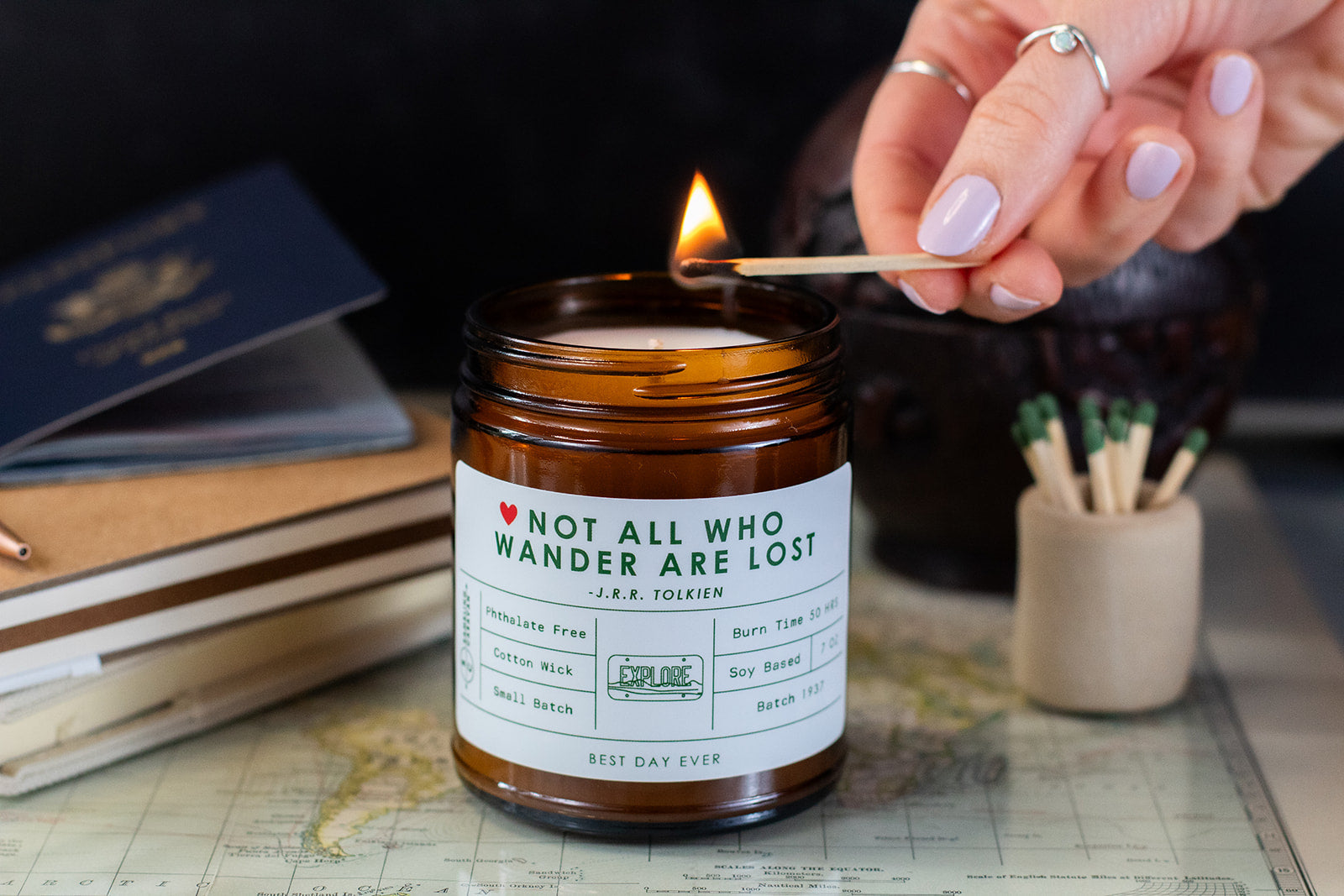 Not All Who Wander Are Lost candle being lit by a match.